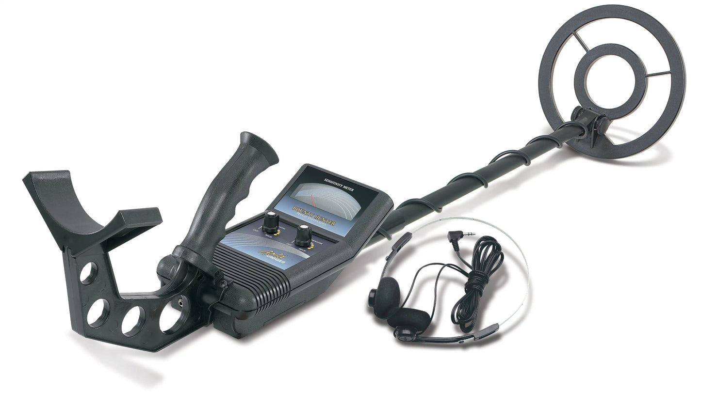 Metal detector with headphones on a white background