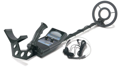 Metal detector with headphones on a white background